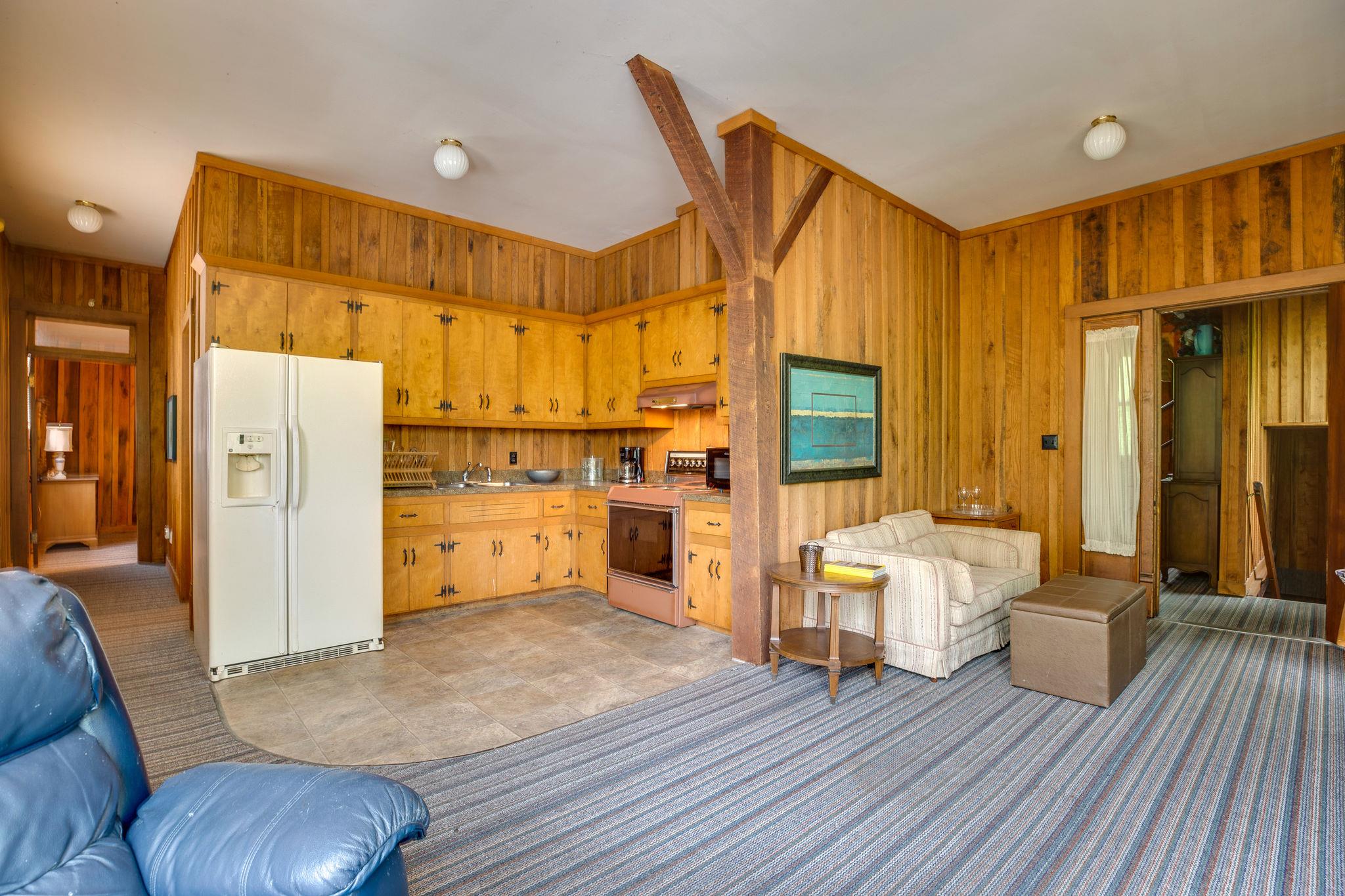 200 Cortner Mill Road Normandy, TN 37360 - Photo 23 of 30 a large room with wooden floor and furniture