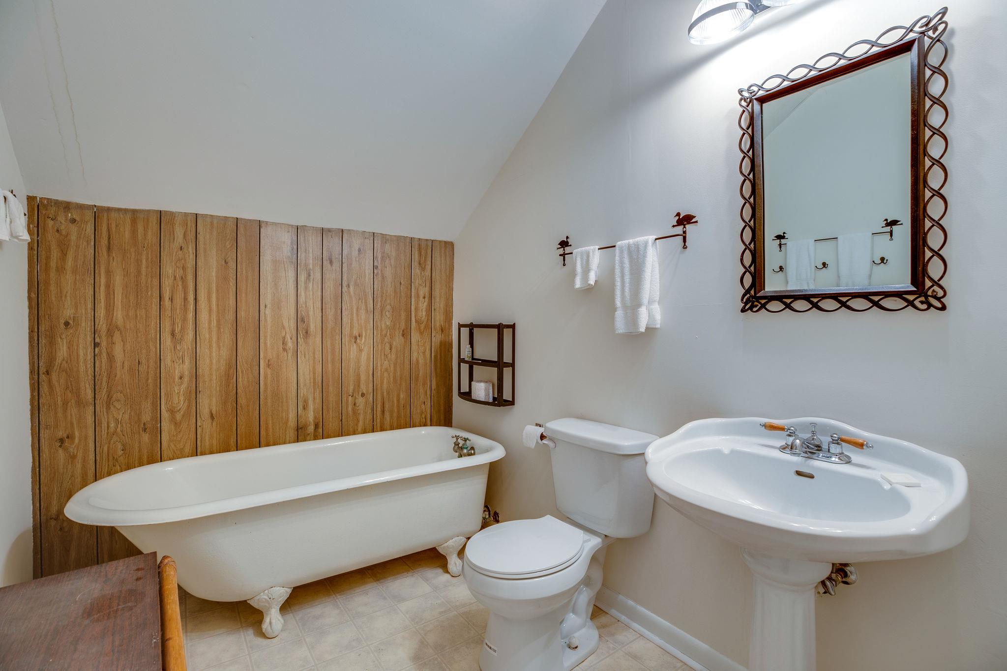 200 Cortner Mill Road Normandy, TN 37360 - Photo 30 of 30 a bathroom with a sink a toilet and mirror