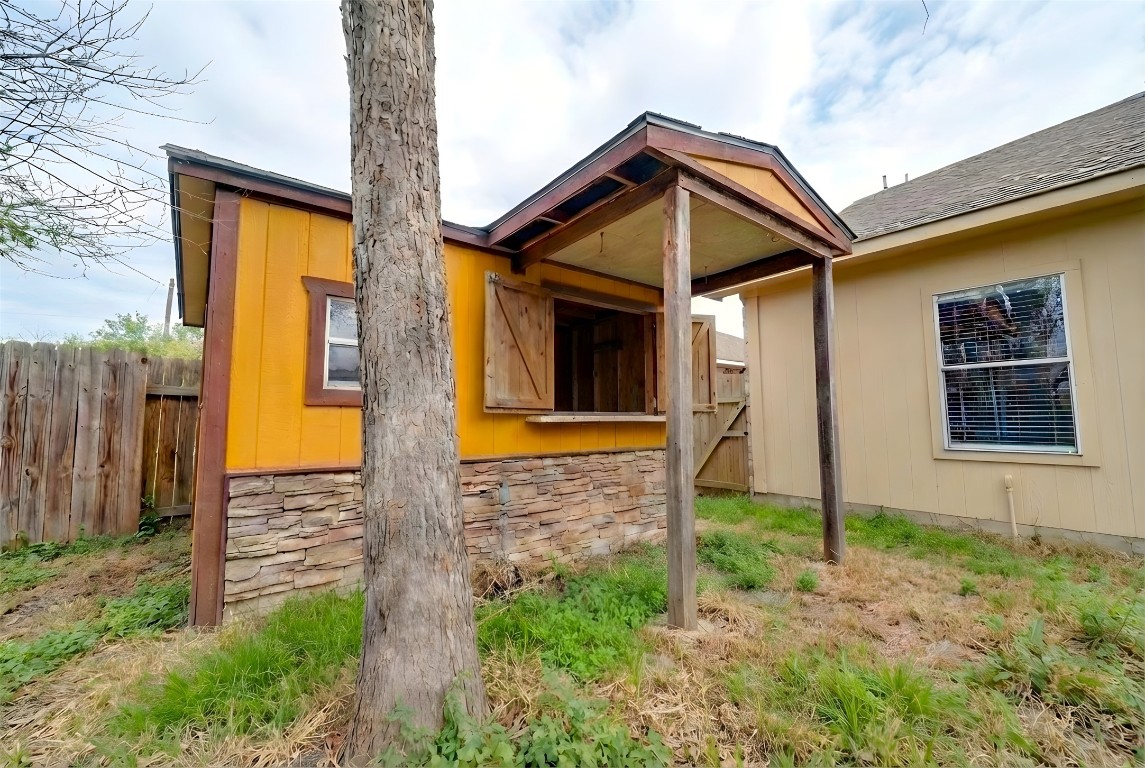 350 Carriage Way Kyle, TX 78640 - Photo 11 of 37 a front view of a house with garden
