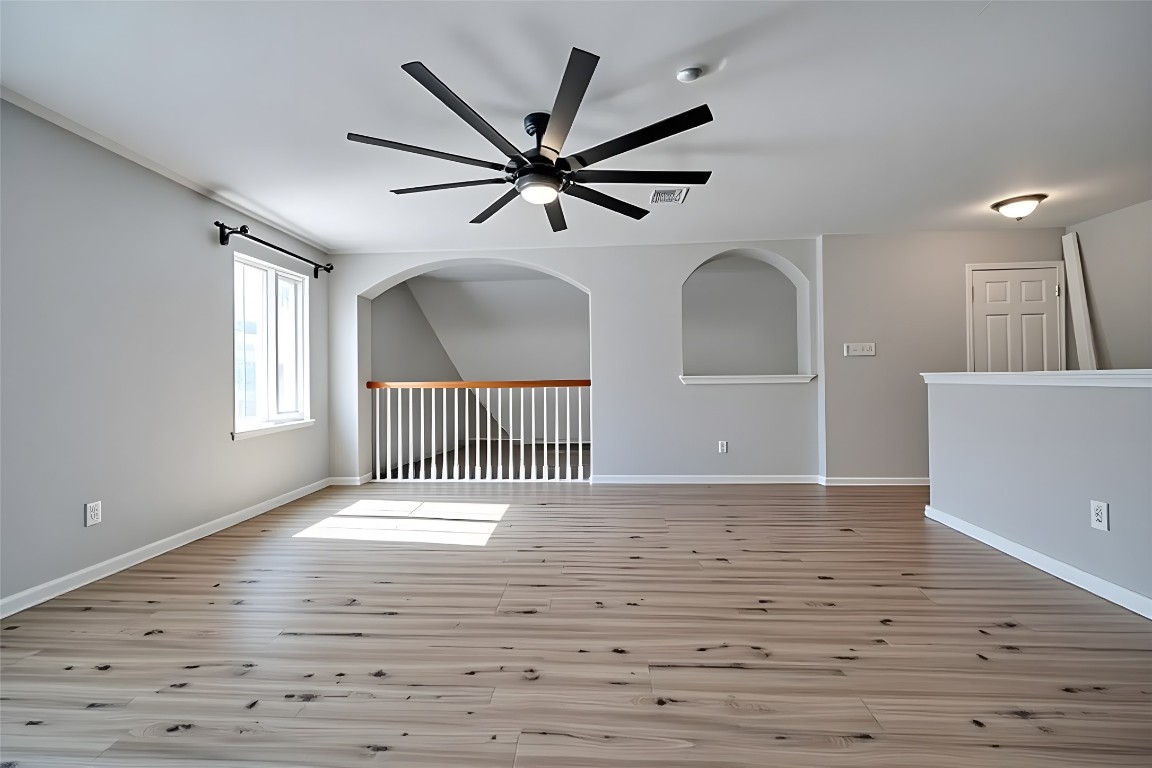 350 Carriage Way Kyle, TX 78640 - Photo 19 of 37 a view of empty room with wooden floor and fan