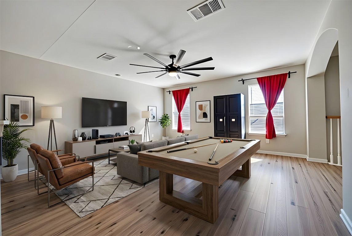 350 Carriage Way Kyle, TX 78640 - Photo 20 of 37 a living room with stainless steel appliances kitchen island granite countertop furniture and a flat screen tv