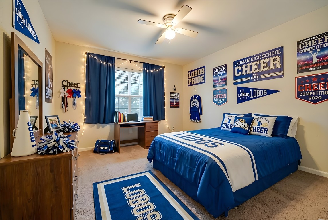 350 Carriage Way Kyle, TX 78640 - Photo 22 of 37 a bedroom with furniture and a large window