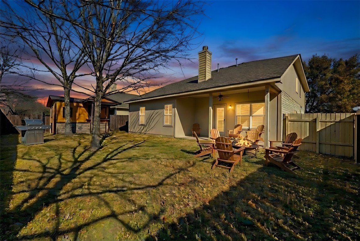 350 Carriage Way Kyle, TX 78640 - Photo 28 of 37 a backyard of a house with table and chairs