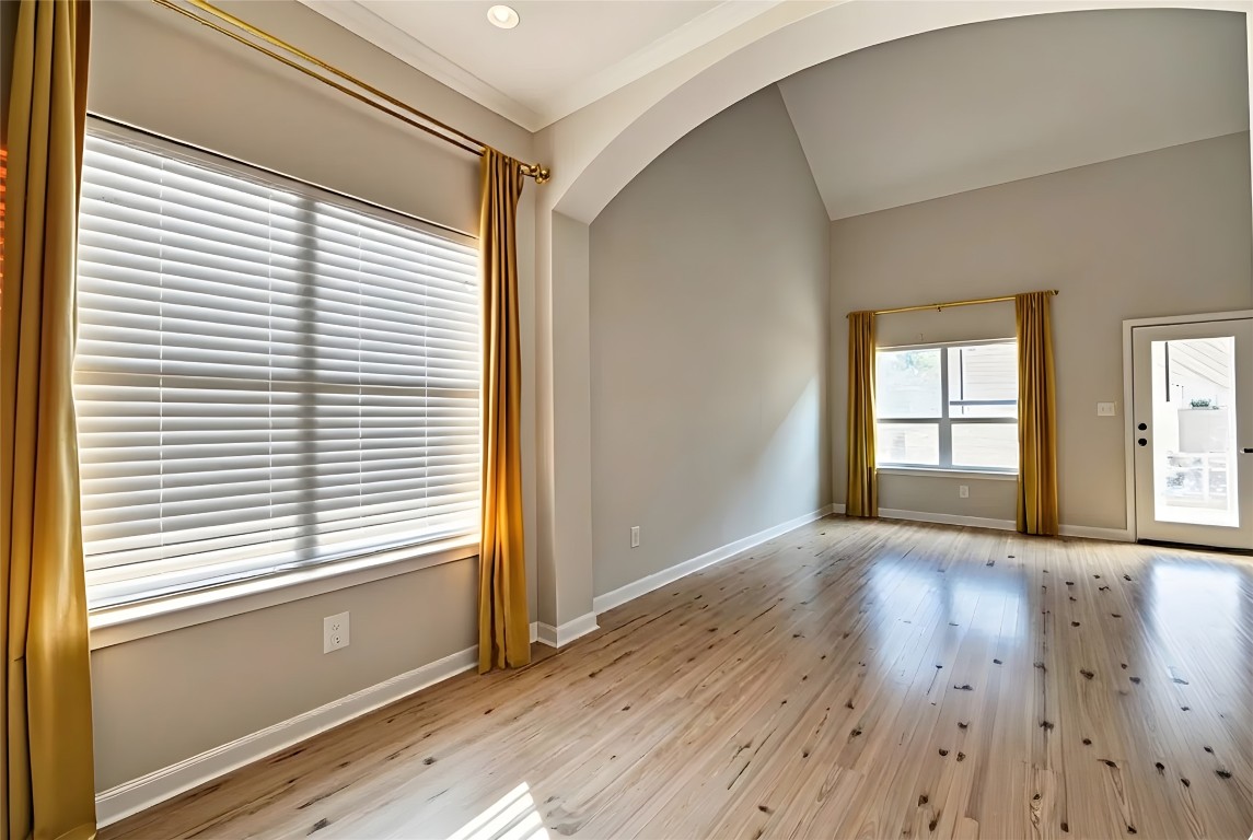 350 Carriage Way Kyle, TX 78640 - Photo 10 of 37 a view of an empty room with wooden floor and a window