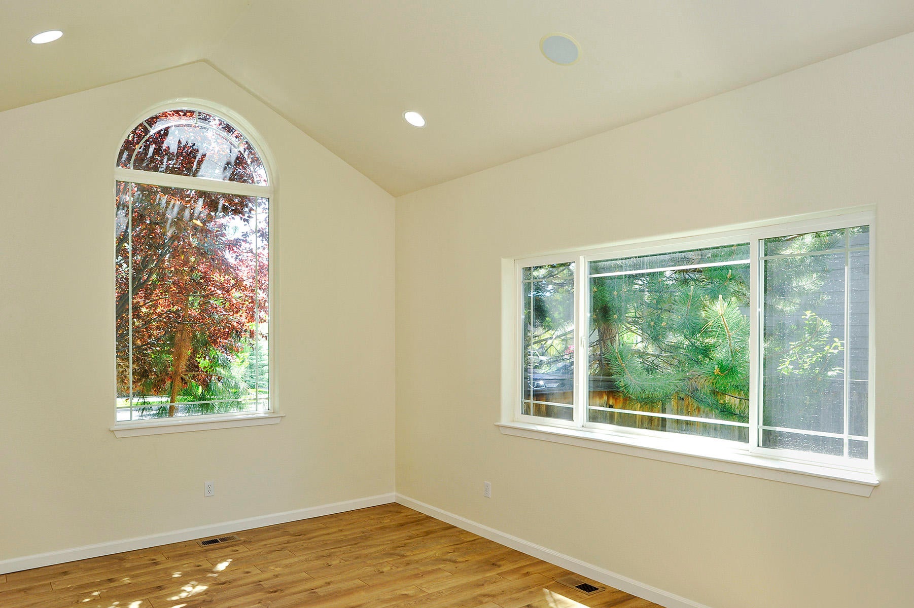 19834 Powers Road Bend, OR 97702 - Photo 3 of 22 Large main floor office or bonus space off entry with vaulted ceiling, picture windows, speaker system & french doors.