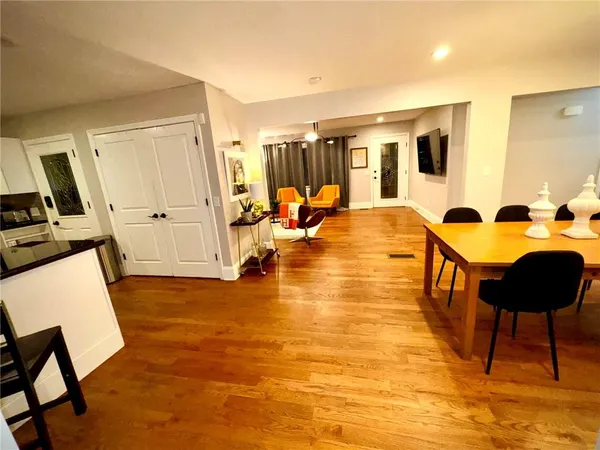 a view of a living room and dining room