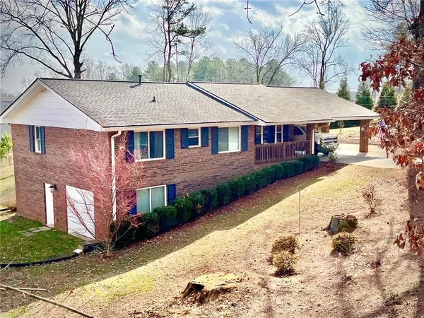 a aerial view of a house with a yard