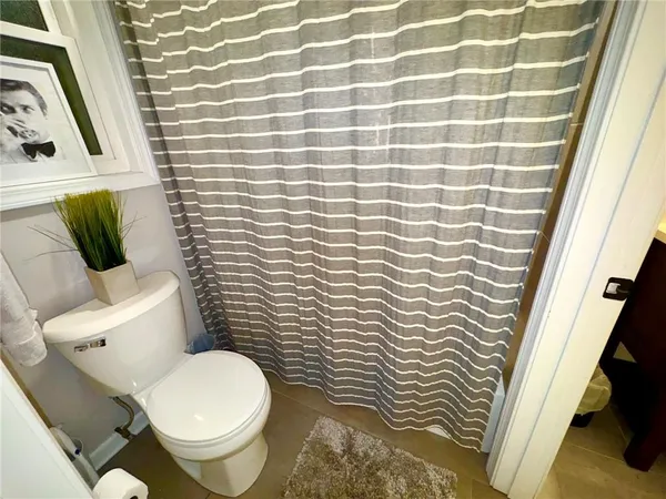 a bathroom with a toilet and a sink