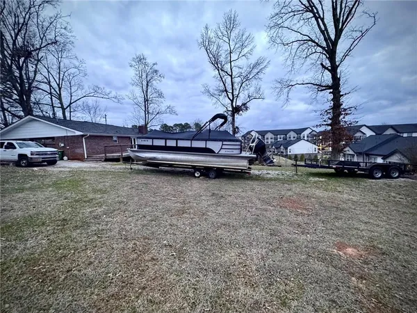 a view of balcony with furniture and wooden floor