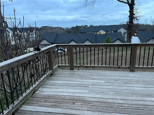 a view of a house with a yard covered in snow