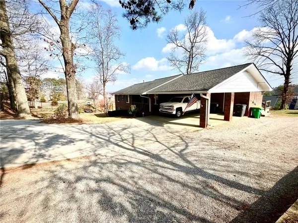 a swimming pool with outdoor seating and yard