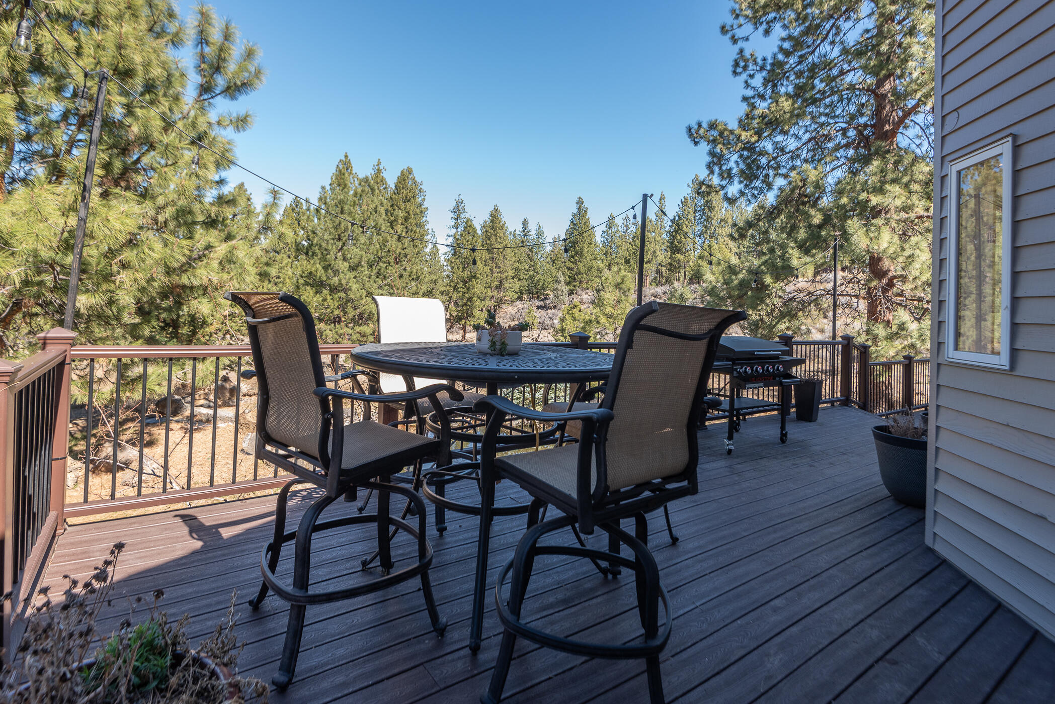 60012 West Ridgeview Drive Bend, OR 97702 - Photo 36 of 55 a view of a chairs and table on the wooden floor
