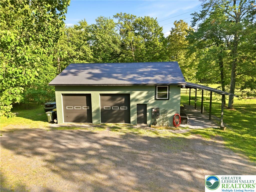 9033 Loop Road Slatington, PA 18080 - Photo 13 of 53 A detached garage offers ample storage and covered outdoor space.