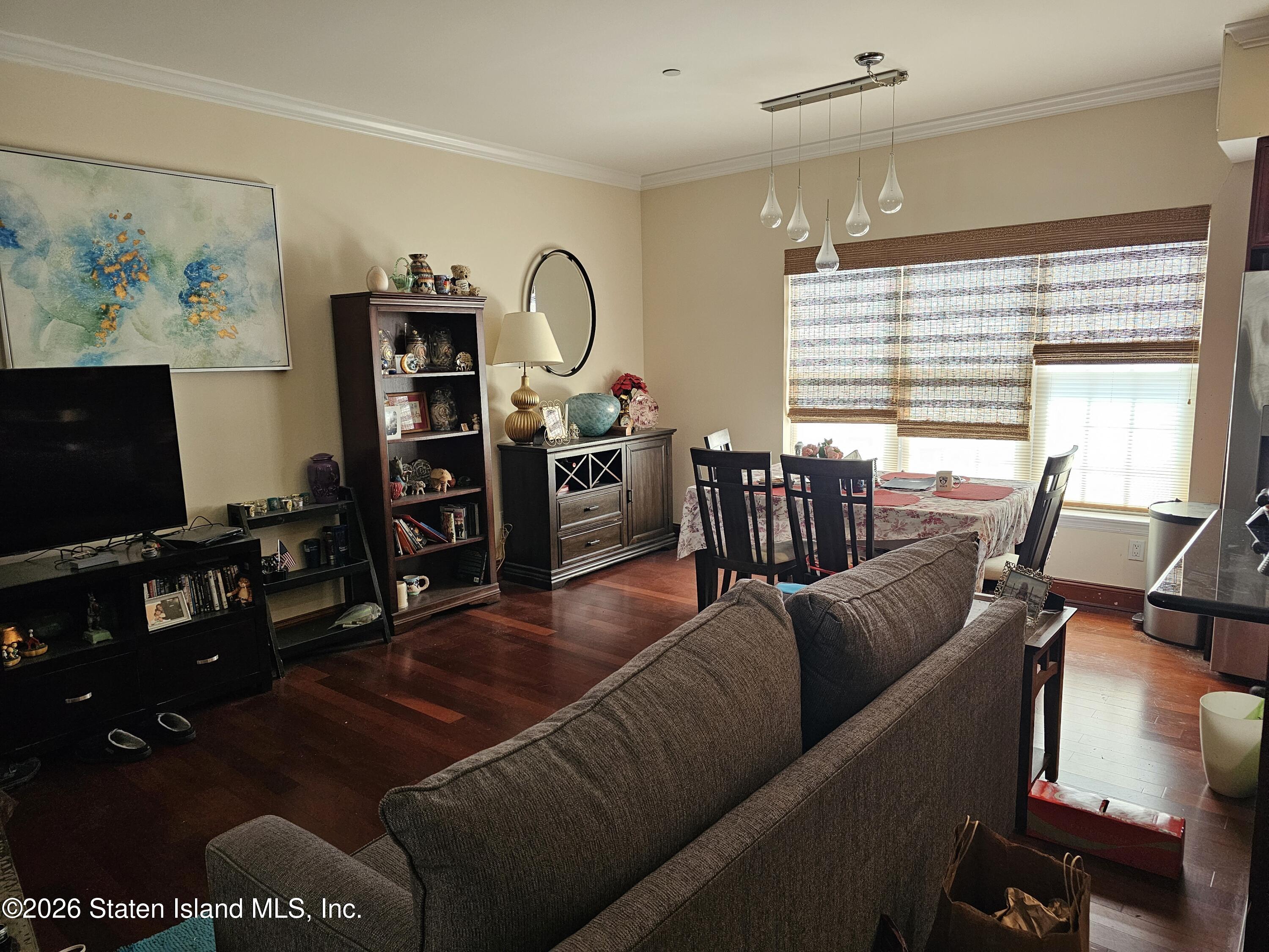 3871 Amboy Road, Unit 404 Staten Island, NY 10308 - Photo 5 of 17 a living room with furniture workspace and a window