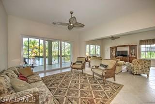 9255 Museo Circle, Unit 204 Naples, FL 34114 - Photo 11 of 27 a living room with furniture large window and a table