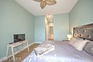 9255 Museo Circle, Unit 204 Naples, FL 34114 - Photo 13 of 27 a bedroom with a bed and flat screen tv