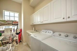9255 Museo Circle, Unit 204 Naples, FL 34114 - Photo 20 of 27 a utility room with dryer and washer