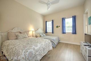 9255 Museo Circle, Unit 204 Naples, FL 34114 - Photo 22 of 27 a bedroom with double bed and a flat tv screen on a dresser