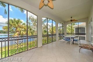 9255 Museo Circle, Unit 204 Naples, FL 34114 - Photo 5 of 27 a dining room with furniture large windows and a chandelier