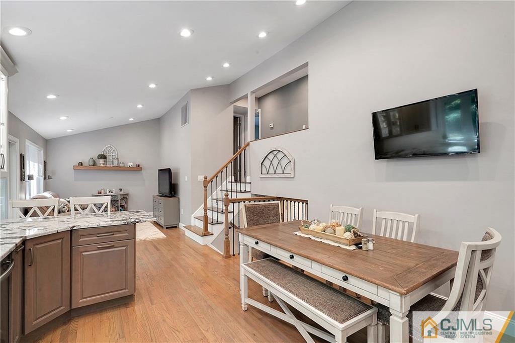 97 Rieder Road Spotswood, NJ 08884 - Photo 12 of 37 a living room with stainless steel appliances furniture and a flat screen tv