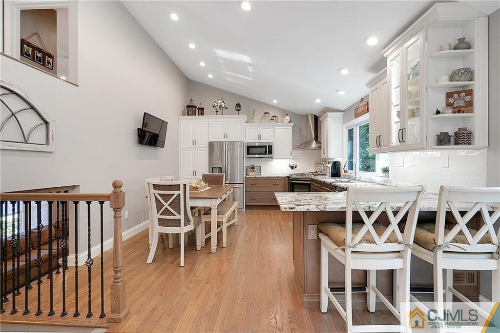 97 Rieder Road Spotswood, NJ 08884 - Photo 15 of 37 a view of a dining room with furniture and wooden floor