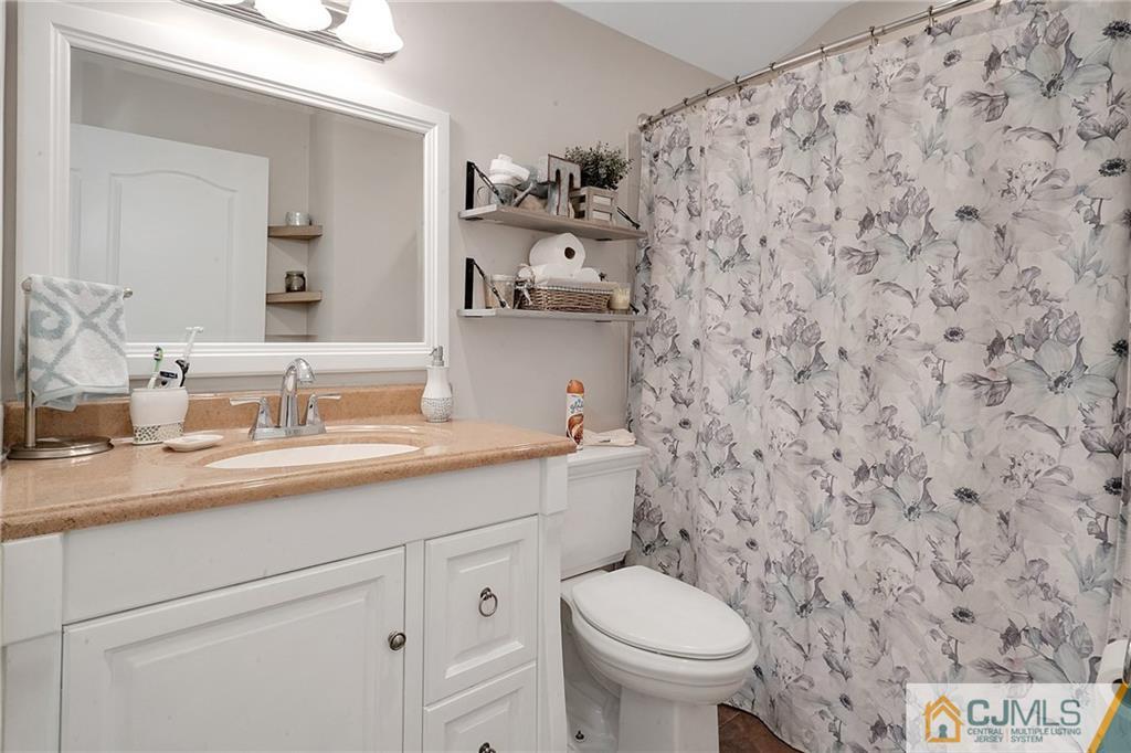 97 Rieder Road Spotswood, NJ 08884 - Photo 20 of 37 a bathroom with a granite countertop sink and a toilet