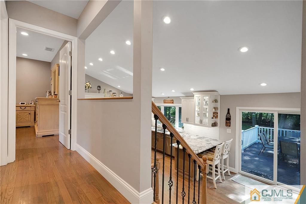 97 Rieder Road Spotswood, NJ 08884 - Photo 21 of 37 a view of a hallway with wooden floor and windows