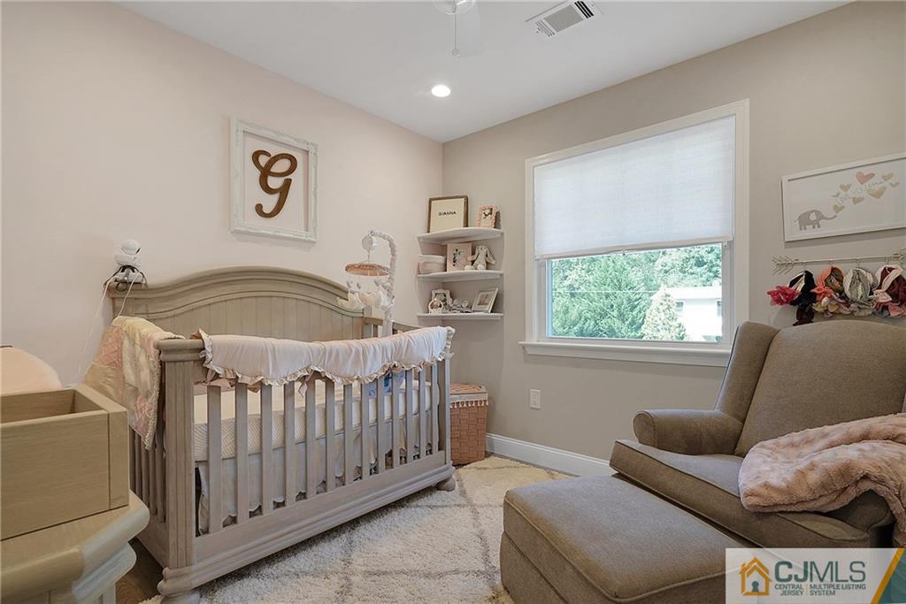 97 Rieder Road Spotswood, NJ 08884 - Photo 23 of 37 a bedroom with furniture and a window