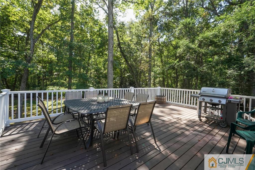 97 Rieder Road Spotswood, NJ 08884 - Photo 32 of 37 a view of a deck with furniture and wooden floor