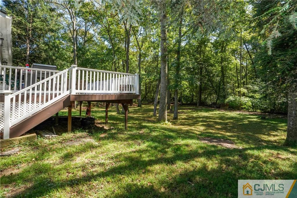 97 Rieder Road Spotswood, NJ 08884 - Photo 34 of 37 a view of a chair and table in the backyard