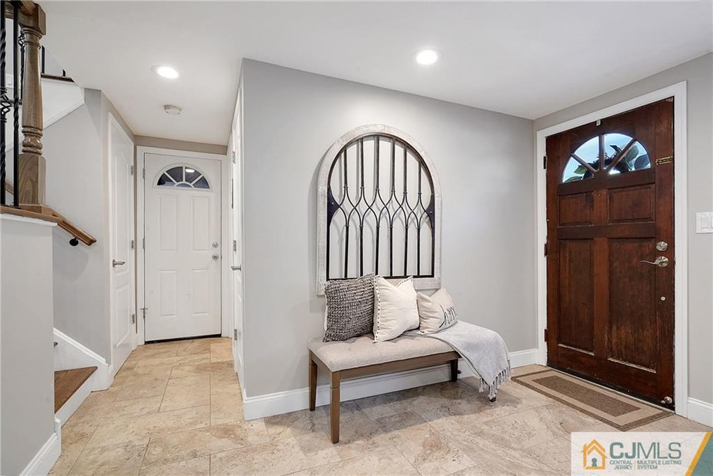 97 Rieder Road Spotswood, NJ 08884 - Photo 8 of 37 a living room with furniture and a gate