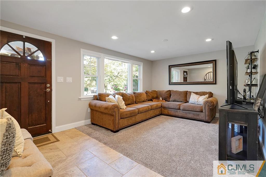 97 Rieder Road Spotswood, NJ 08884 - Photo 9 of 37 a living room with furniture and a flat screen tv