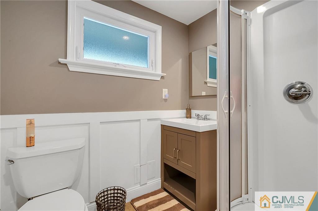 97 Rieder Road Spotswood, NJ 08884 - Photo 10 of 37 a bathroom with a sink and a mirror