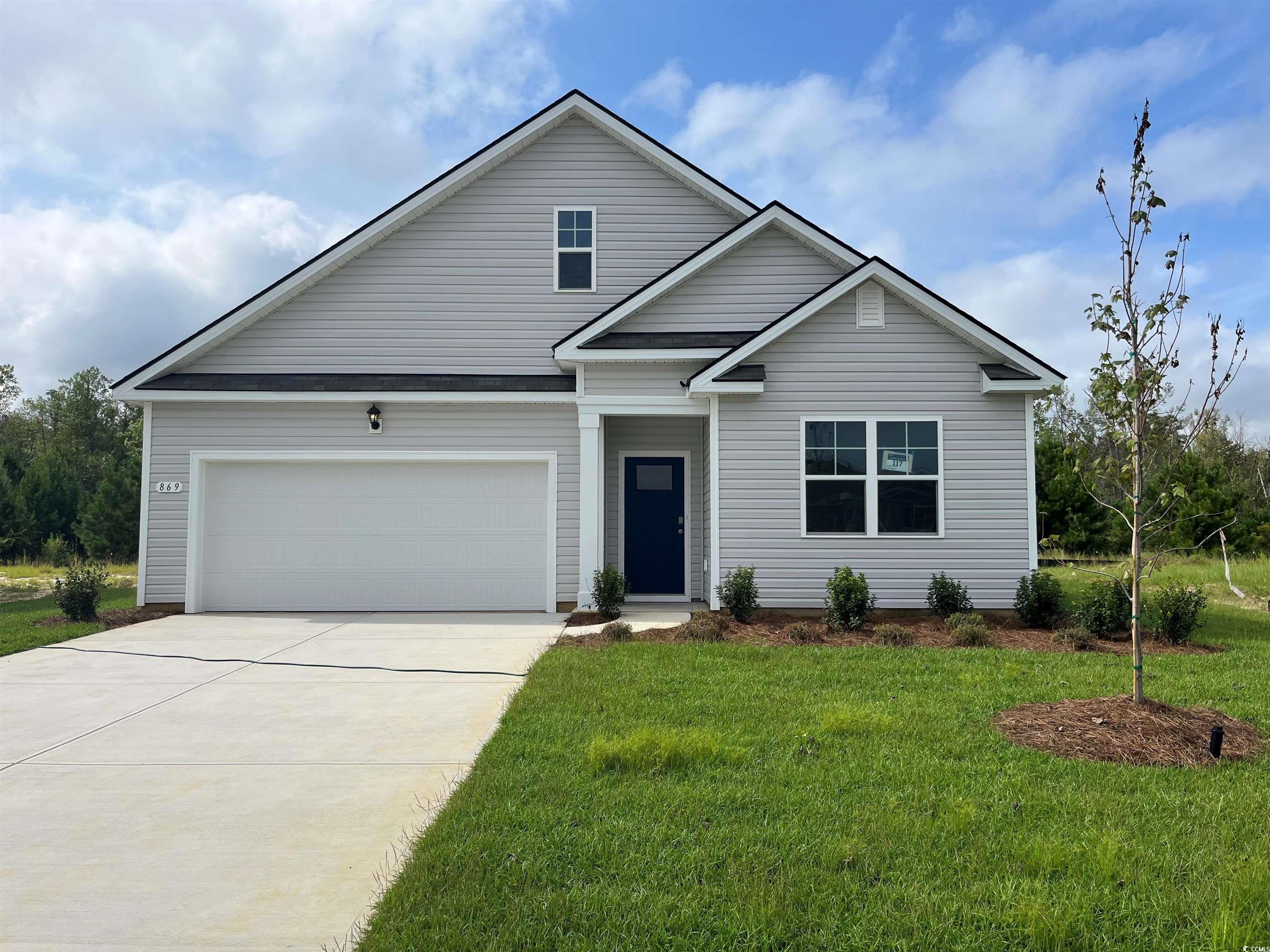 869 Farmers Passage Loop Loris, SC 29569 - Photo 1 of 26 View of front facade featuring a garage, concrete driveway, and a front yard