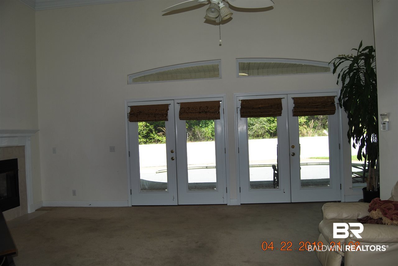 411 Juniper Creek Road Brewton, AL 36426 - Photo 17 of 35 Wall of windows looking out to patio and pool