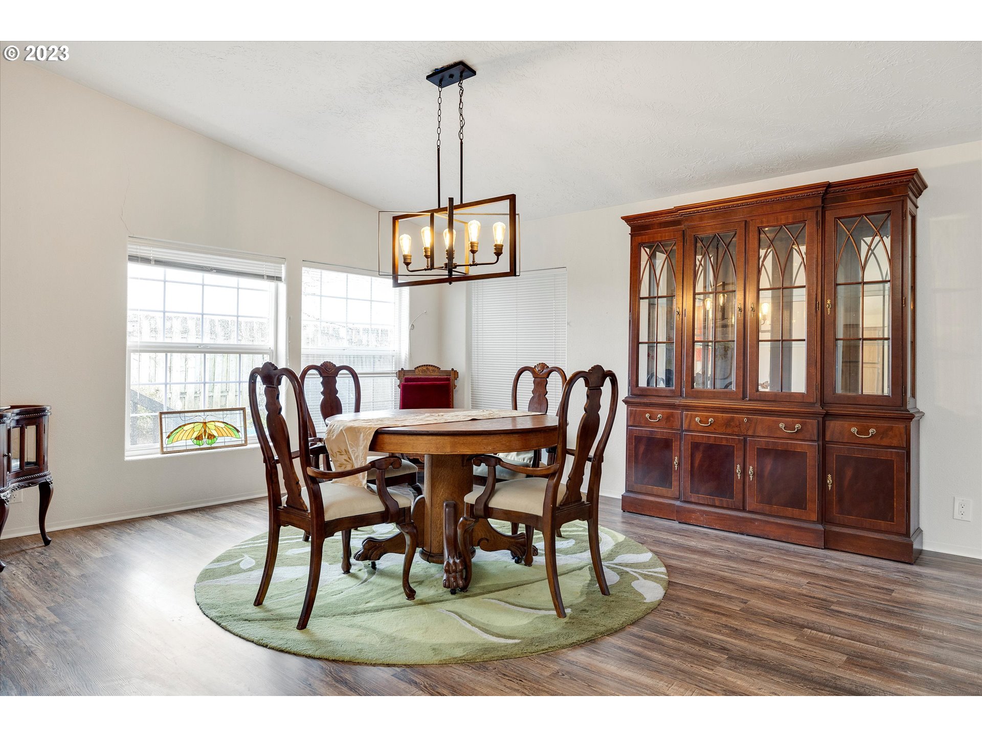 1949 Southeast Palmquist Road, Unit 17 Gresham, OR 97080 - Photo 13 of 31 a view of a dining room with furniture window and wooden floor