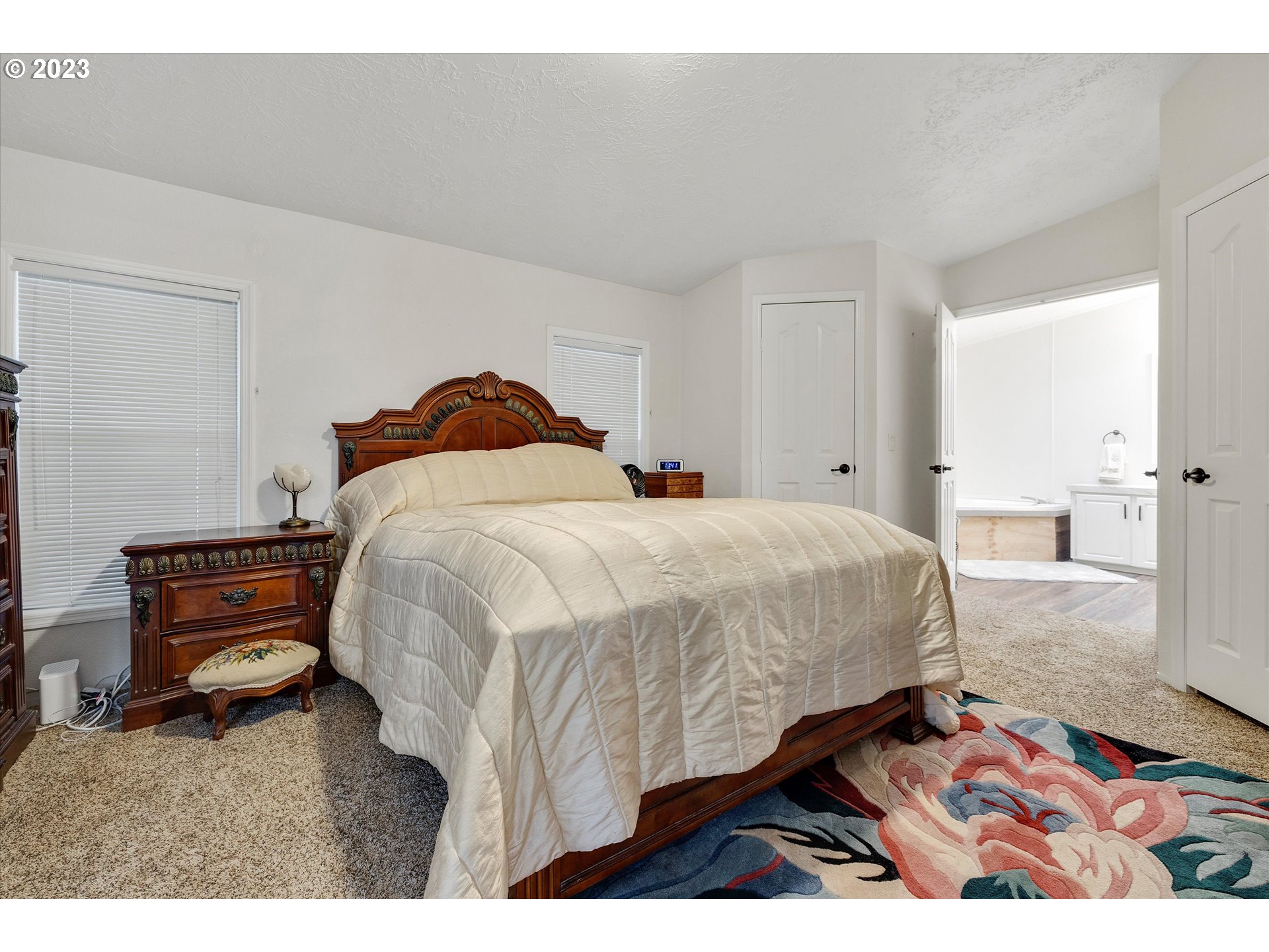 1949 Southeast Palmquist Road, Unit 17 Gresham, OR 97080 - Photo 18 of 31 a bedroom with a bed and dresser