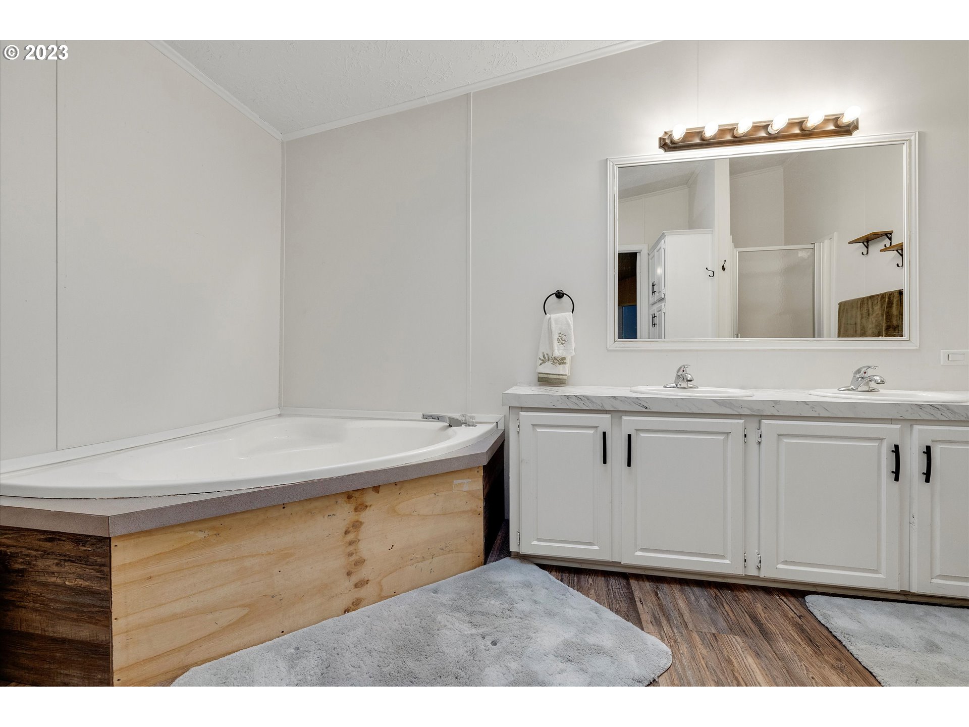1949 Southeast Palmquist Road, Unit 17 Gresham, OR 97080 - Photo 20 of 31 a bathroom with a sink vanity granite and a mirror