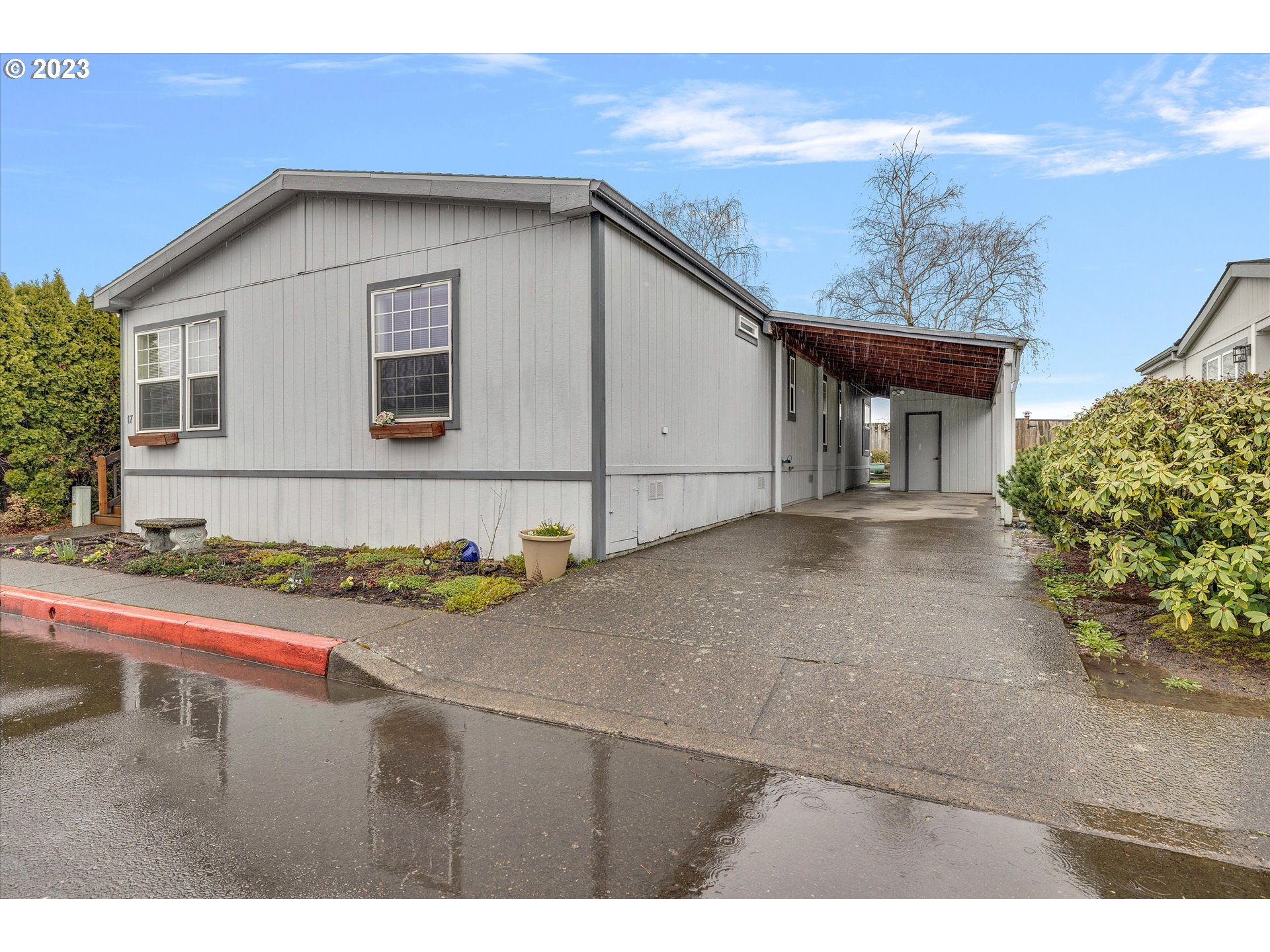 1949 Southeast Palmquist Road, Unit 17 Gresham, OR 97080 - Photo 2 of 31 a bathroom with a sink and a mirror