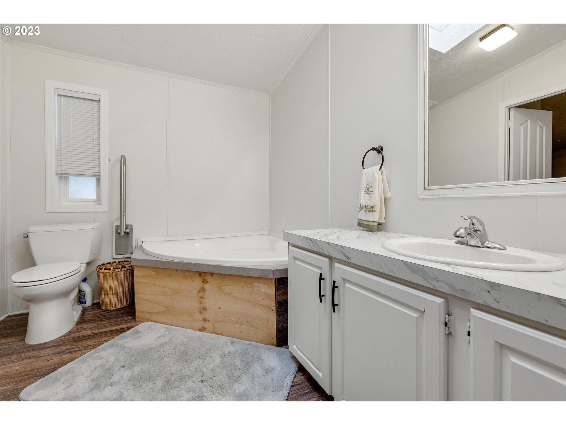 1949 Southeast Palmquist Road, Unit 17 Gresham, OR 97080 - Photo 22 of 31 a bathroom with a sink toilet and a mirror