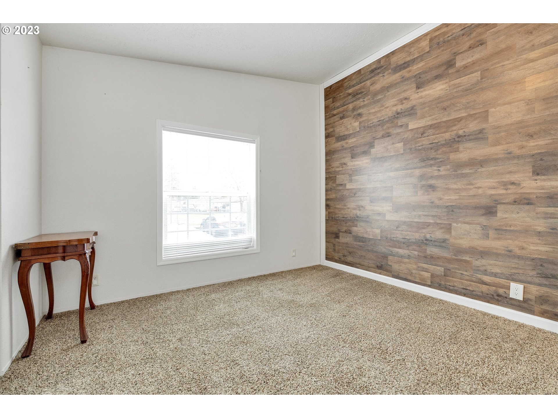 1949 Southeast Palmquist Road, Unit 17 Gresham, OR 97080 - Photo 26 of 31 a view of an empty room and window