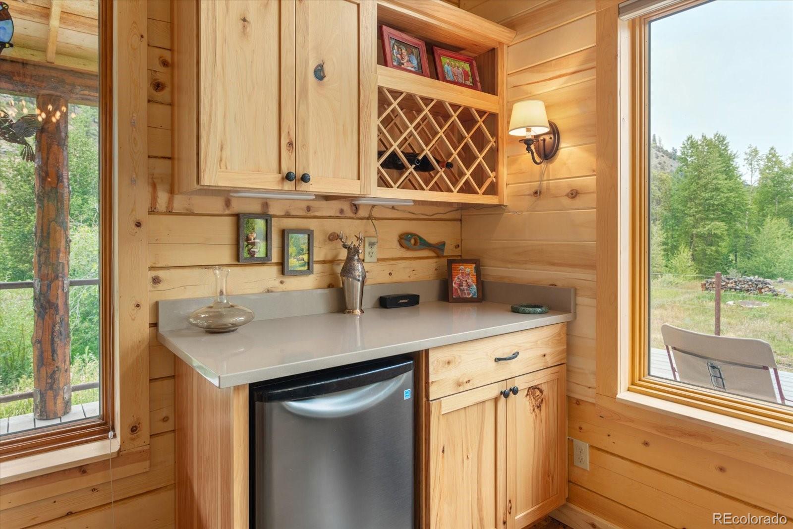 1021 Silver Lakes Road Villa Grove, CO 81155 - Photo 15 of 50 a kitchen with stainless steel appliances granite countertop a sink and a window
