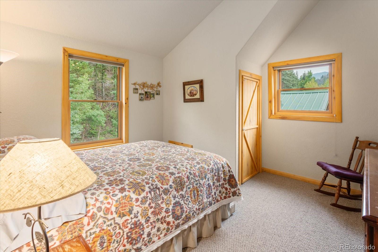 1021 Silver Lakes Road Villa Grove, CO 81155 - Photo 30 of 50 a bedroom with a bed and a window
