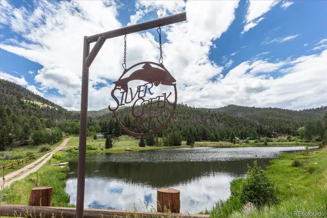 a view of lake with a yard