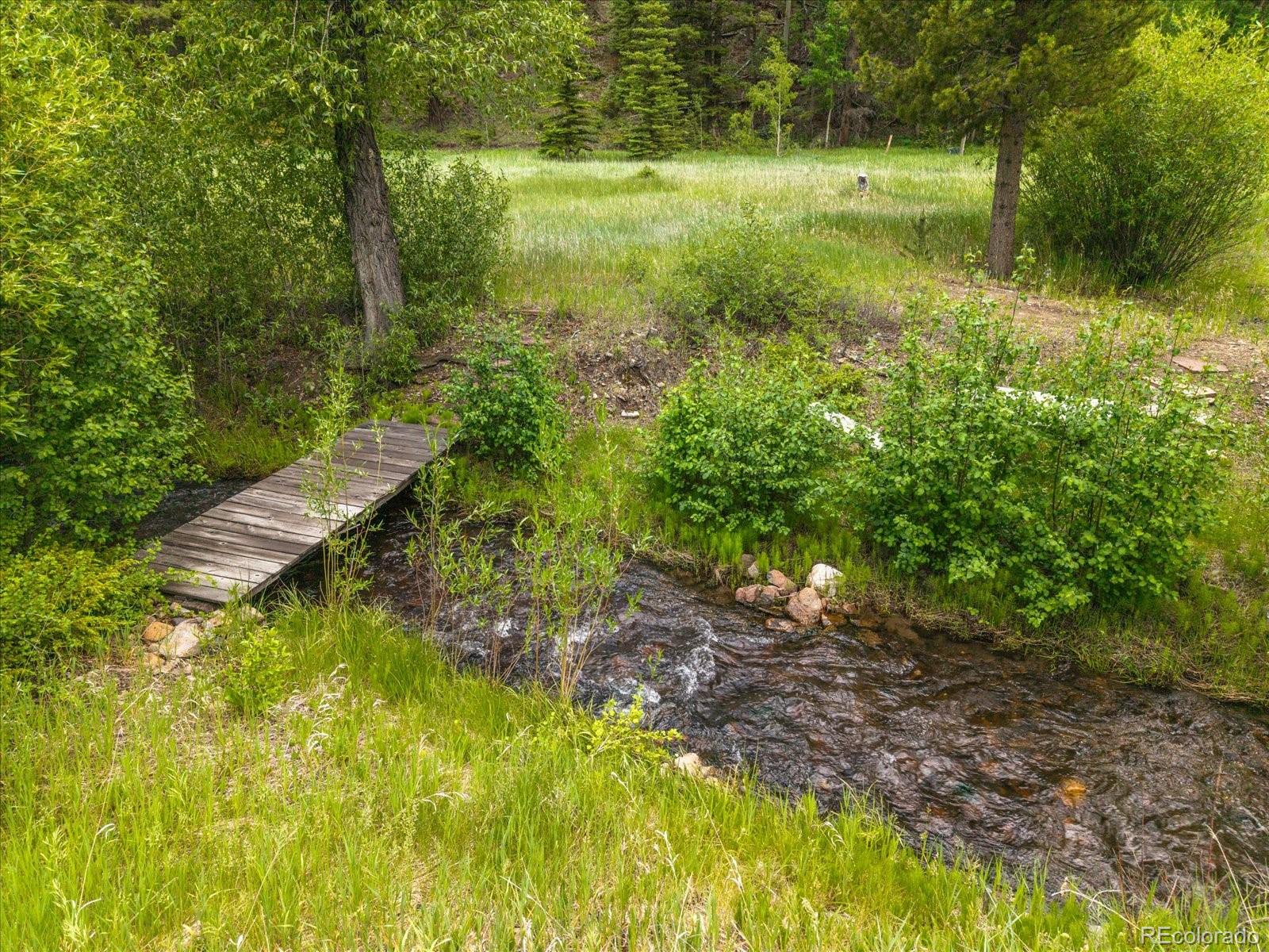 1021 Silver Lakes Road Villa Grove, CO 81155 - Photo 45 of 50 a view of a lake with a yard