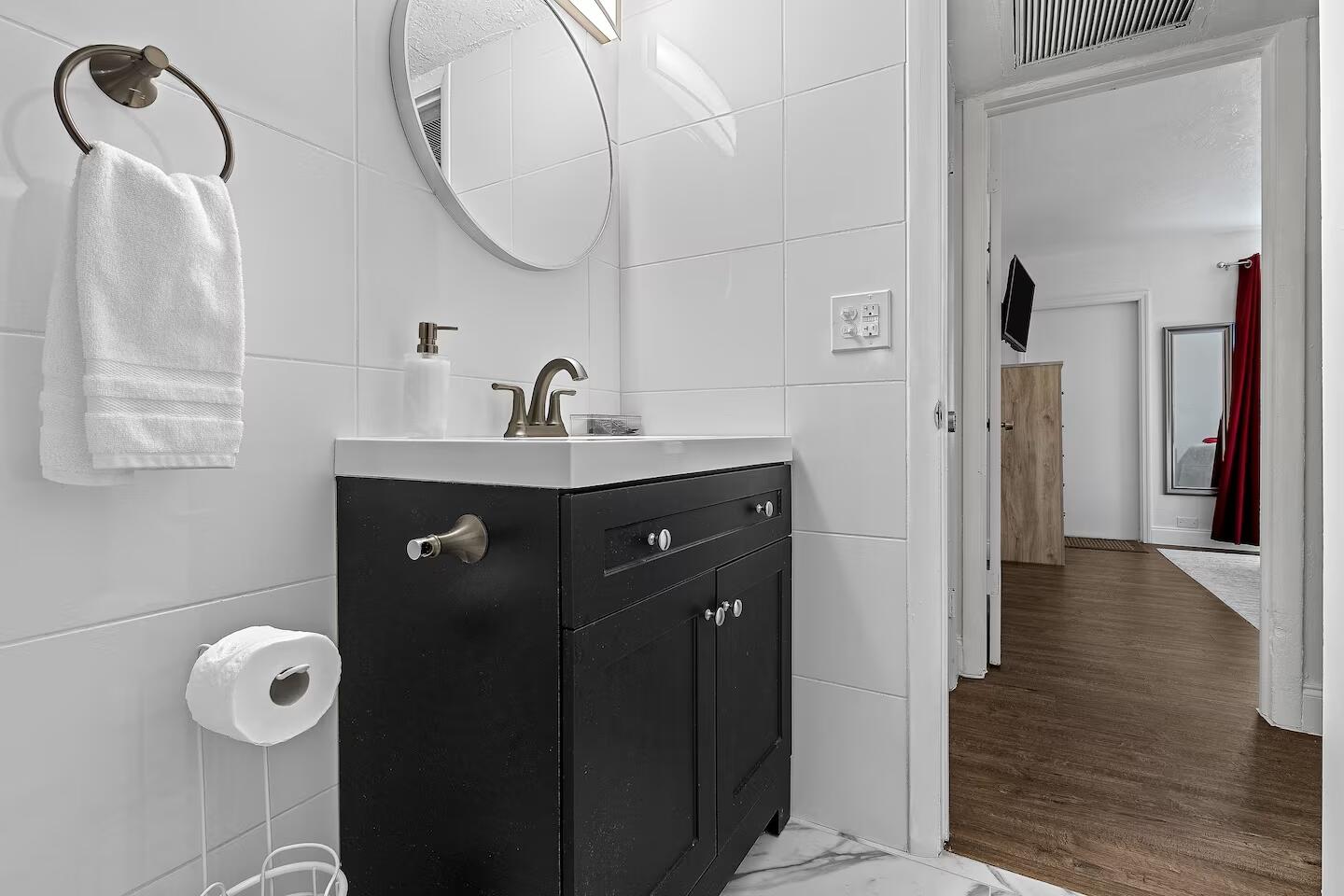 101 Northeast 4th Street, Unit 2 Delray Beach, FL 33444 - Photo 11 of 13 a bathroom with a sink and a mirror