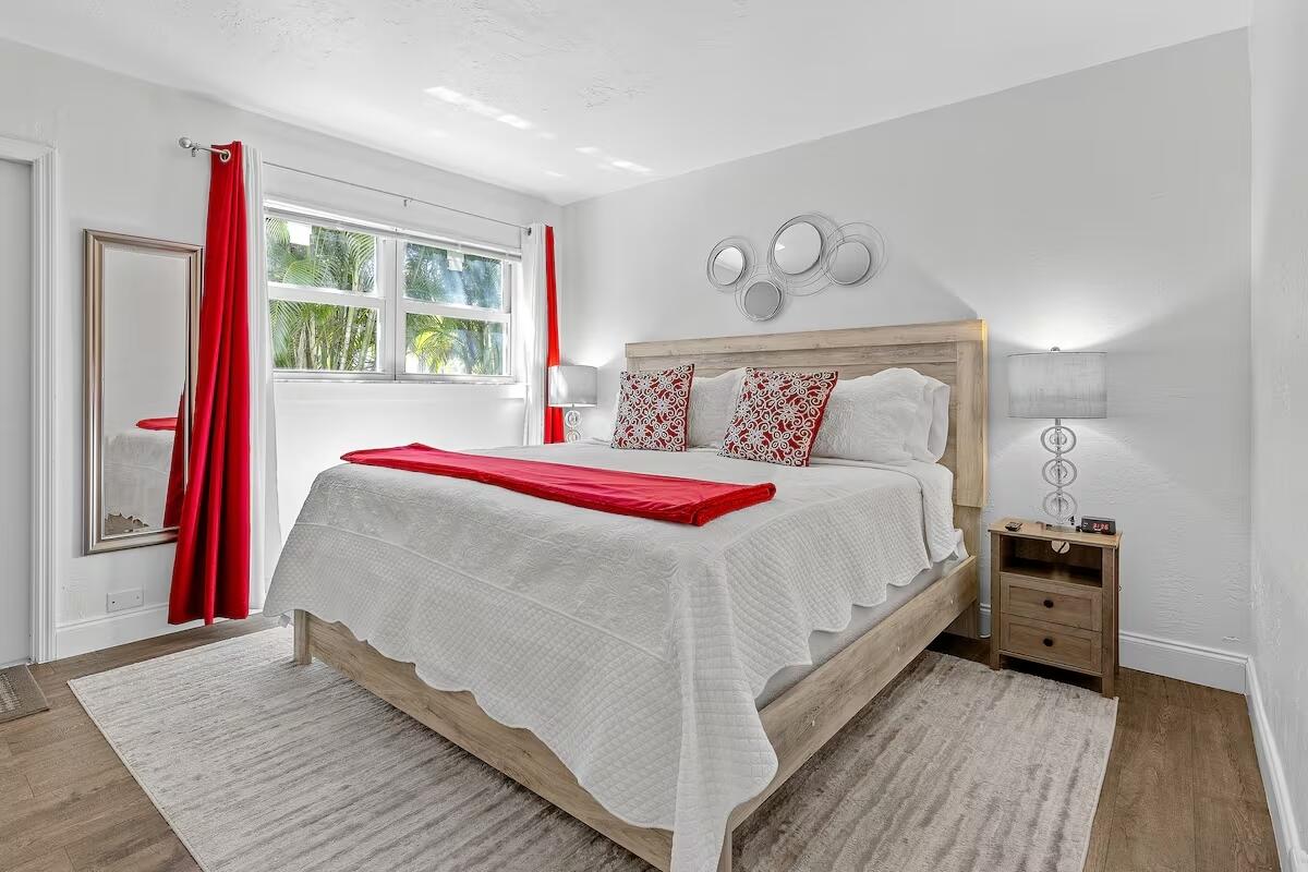 101 Northeast 4th Street, Unit 2 Delray Beach, FL 33444 - Photo 4 of 13 a bed sitting in a bedroom next to a window