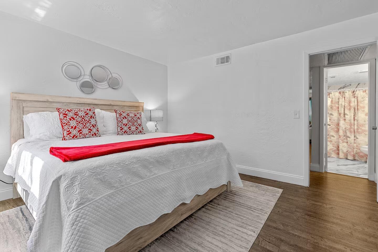 101 Northeast 4th Street, Unit 2 Delray Beach, FL 33444 - Photo 5 of 13 a bed sitting in a bedroom next to a window