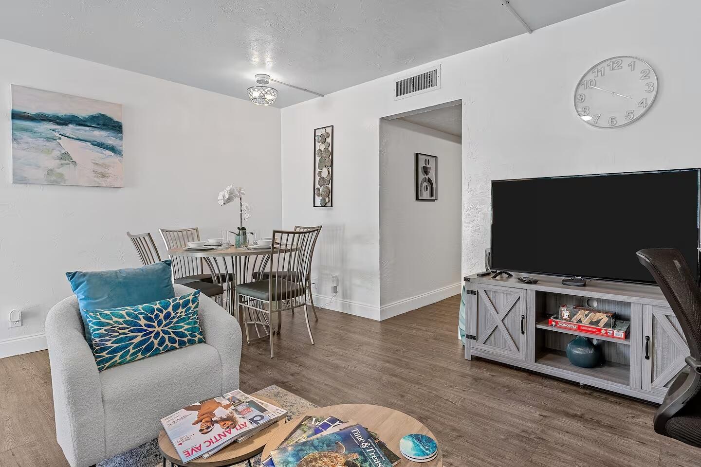 101 Northeast 4th Street, Unit 2 Delray Beach, FL 33444 - Photo 8 of 13 a living room with furniture and a flat screen tv