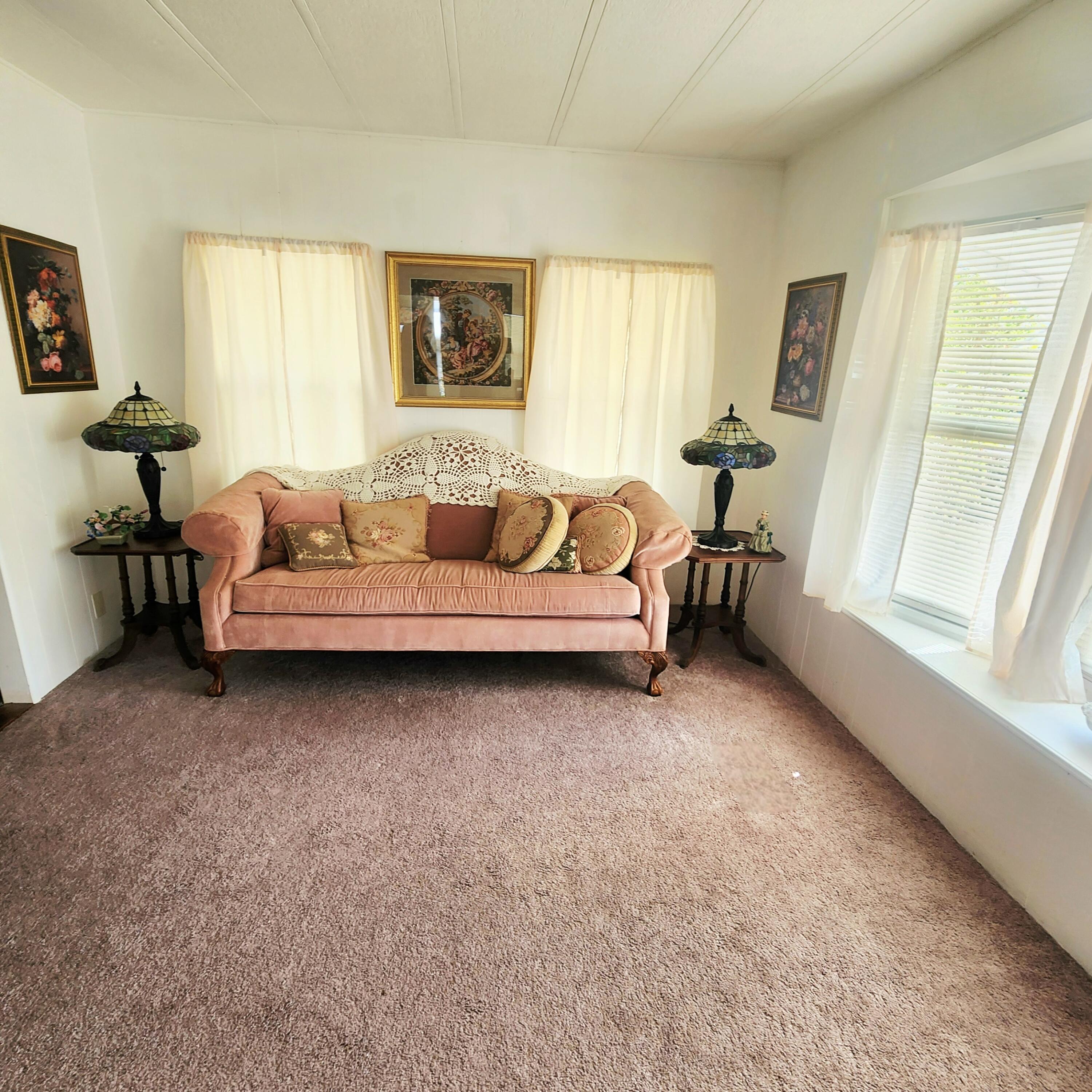 98 Camino Del Rio Port St. Lucie, FL 34952 - Photo 11 of 60 a living room with furniture and a window
